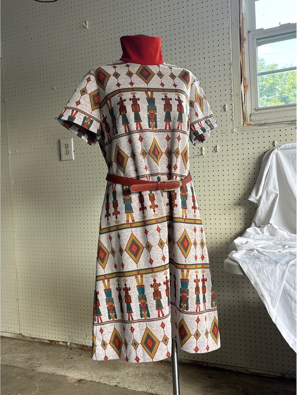 Vintage Geometric and Figure Print Dress with Red Turtleneck Collar and Belt